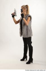 NIKOL STANDING POSE WITH TWO GUNS